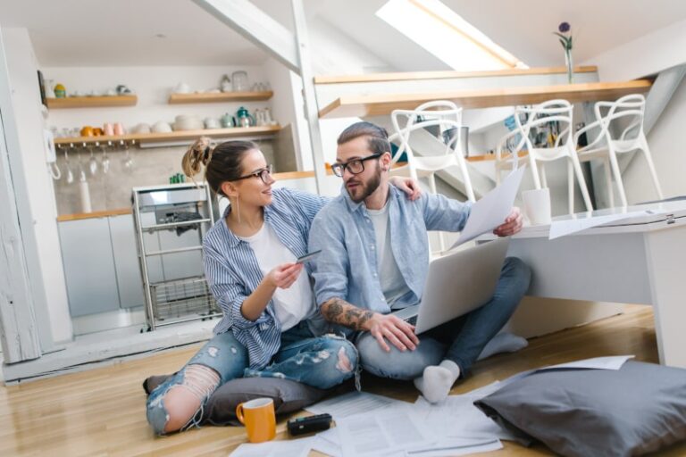 couple sitting on living room floor